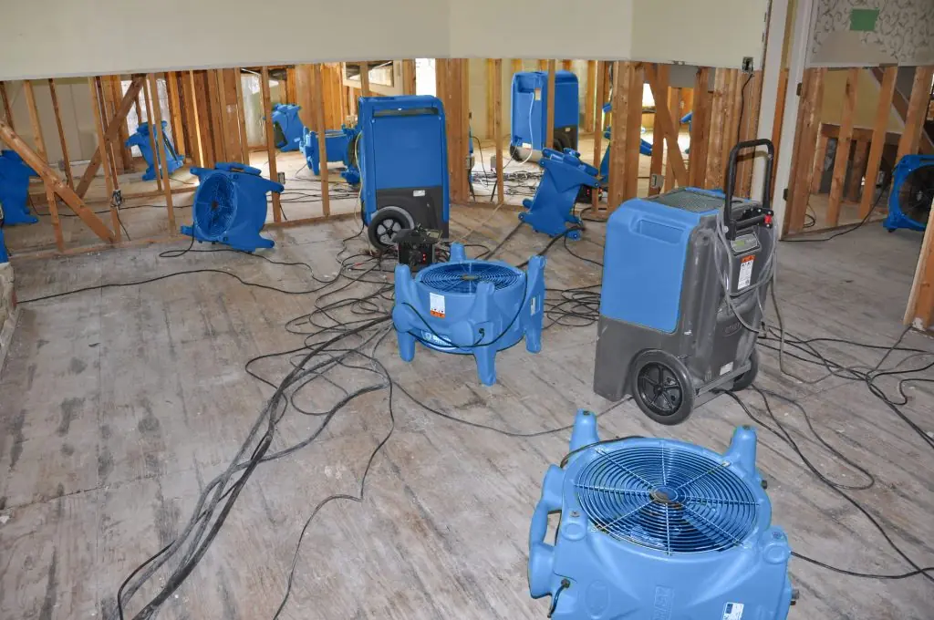 Air movers drying a gutted Rancho Cucamonga room after major water damage